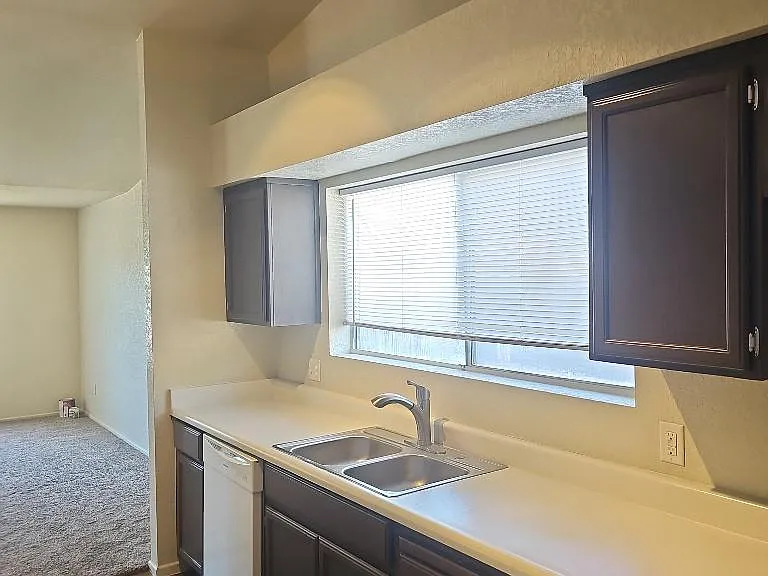 Kitchen includes gas stove and dishwasher.
