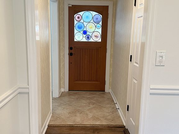Entry hallway looking towards front door from family room/dining room
