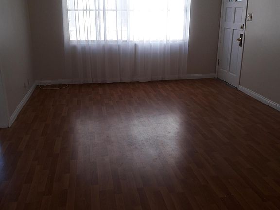 Large living room, High Quality double drapery rods throughout ***DRAPES NOT INCLUDED***. I had to put drapes up in order to be able to take pictures, Lots of light. I am in the process, working with a contractor, to replace all windows on entire build