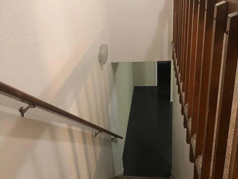Stairway leading to Family Room, 2nd Bathroom, 3rd Bedroom and Laundry Room and Garage.