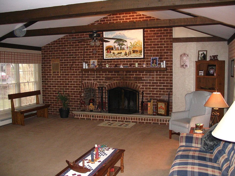 Amazing Family Room with Exposed Beams and Catherdral Ceiling