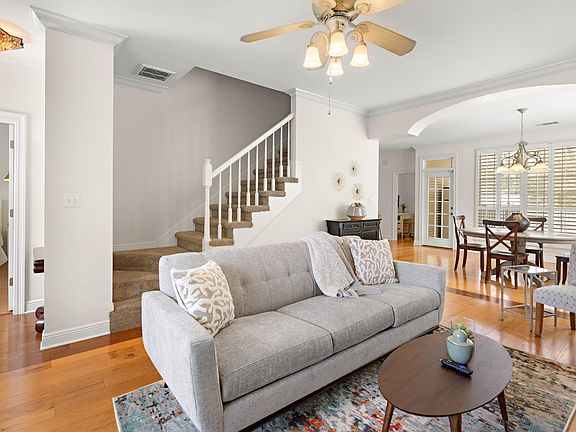 Living Room w/ view of stairs and Master Bedroom