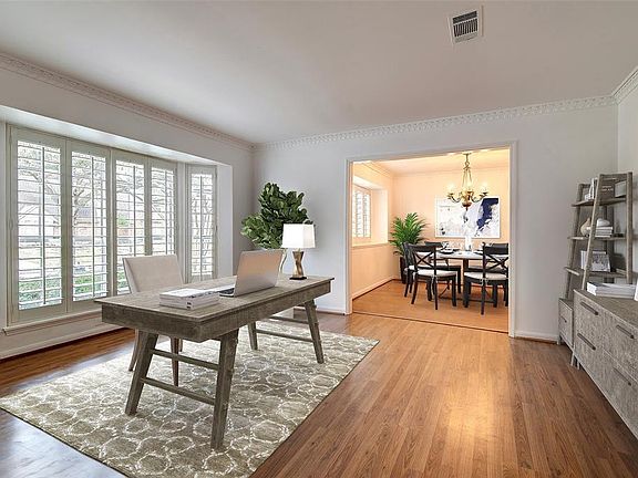 14x12 Living Room - An updated use for a living room at the front of the home. This virtually staged photo shows one of the ways this space could be used.