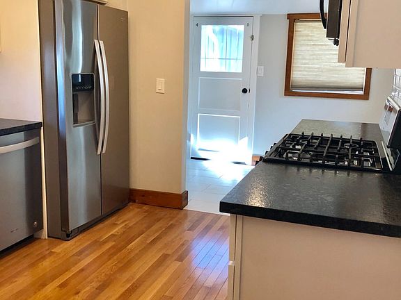 Newly remodeled kitchen 2018, laundry hook up on other side of refrigerator. Backyard access. Space for small kitchen table and chairs