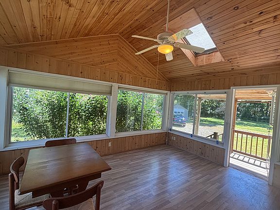 Wonderful three season room, ceiling fan fixture, skylight.