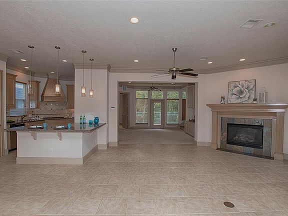 As you enter the home you are greeted by wonderful open space between the family room, the den and the kitchen.