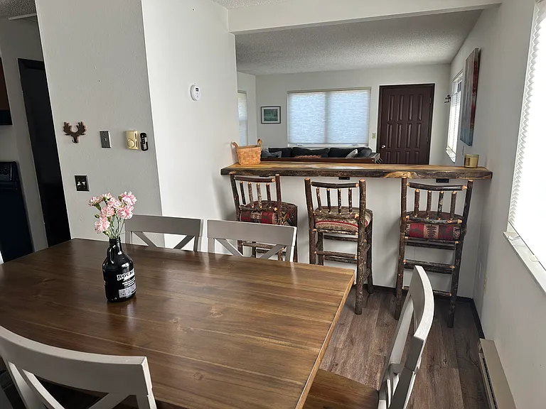 6 person dining table with 3 barstools and custom wood ledge