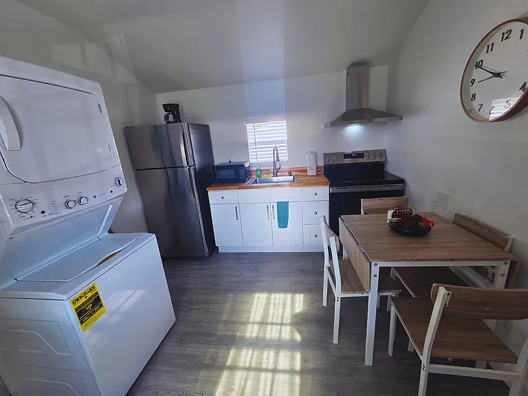 Kitchen and laundry spaces are connected for easy access