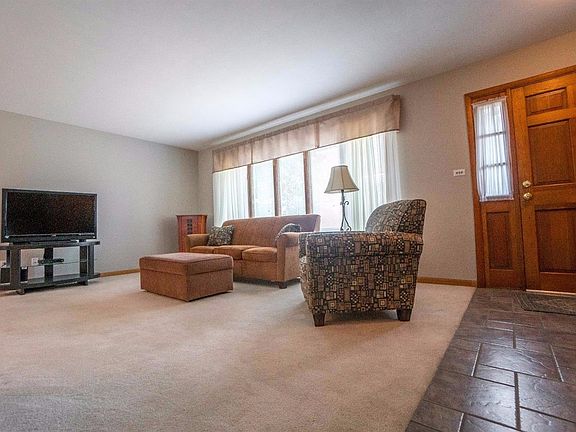 VIEW OF FORAL LIVING ROOM & TILED FOYER!