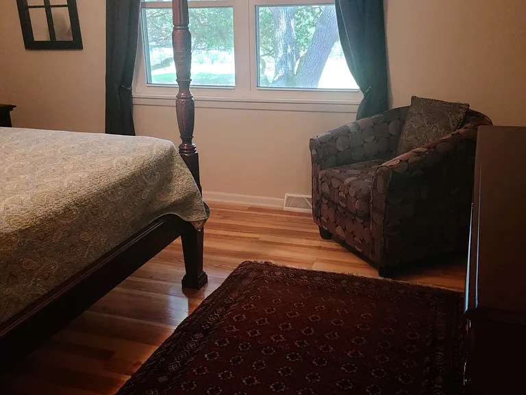 Master Bedroom Overlooking courtyard with oak tree canopy