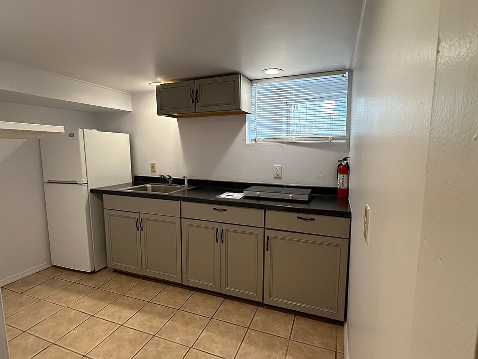 new electric two burner stove, fire extinguisher and refrigerator provided.