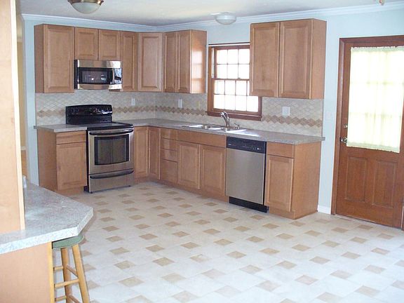 huge kitchen with stainless steel appliances