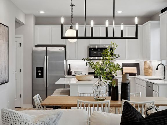 The dining room which opens up into the kitchen. Perfect for family dinners, or entertaining many gu