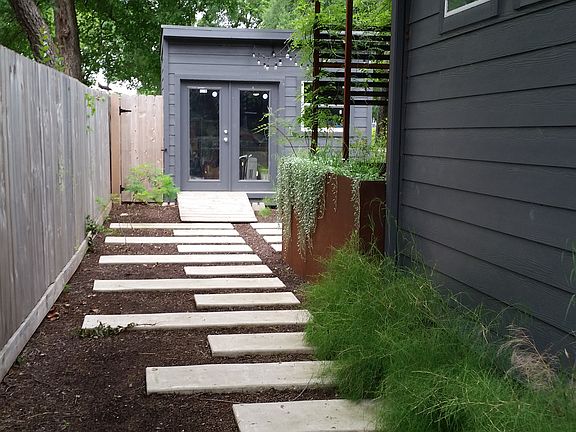 Left of house towards back 