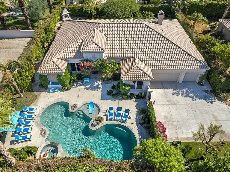 Long driveway with 3 car garage and adjacent to the RLQCC
