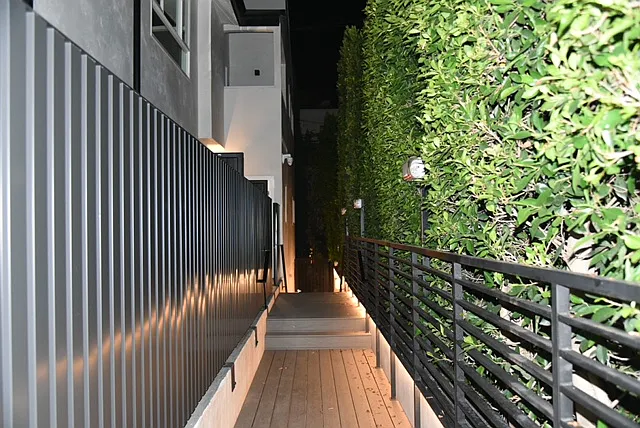 Walk way at night to the back of the building and parking