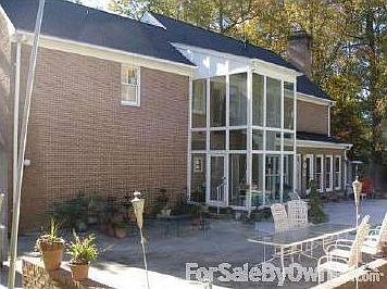 Two story sun porch by the pool.