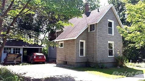 Solid two car garage. There is wood siding underneath waiting to be restored.  But most all the windows have been replaced by Anderson Silverline insulated units.  Heating costs are low with a 90% efficient gas furnace.