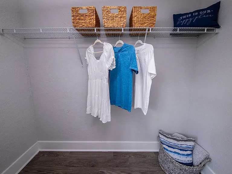 Enjoy the convenience of a large walk-in closet with plenty of hanging space and storage options, perfect for organizing your wardrobe.