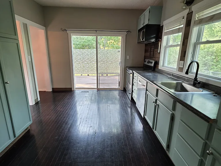 Kitchen, looking the patio door to the deck.