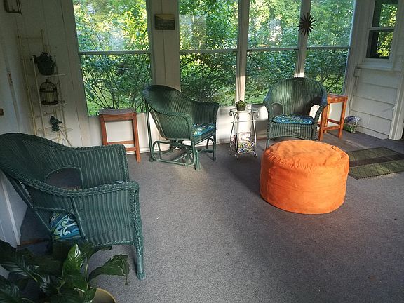 3-season porch/ sunroom and mudroom in winter. Garage is at left, entry into dining room at right. This is where you enter the house from the front