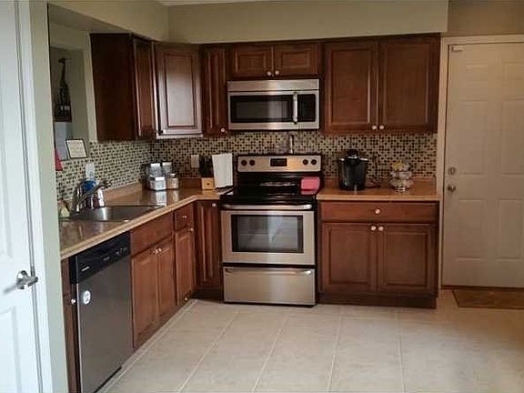 Kitchen. Kitchen with stainless appliances, gorgeous ceramic tile flooring, new cabinets and counter tops!