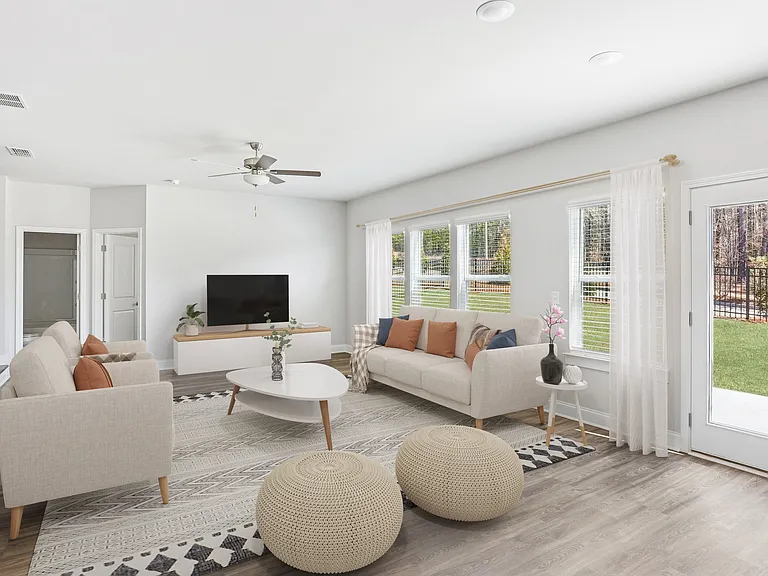 Living room with large windows and abundant natural light.