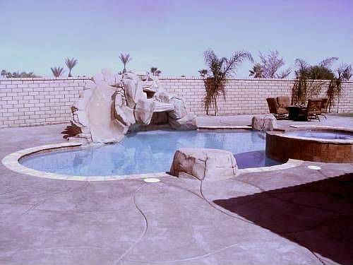 Stamped Concrete Patio Surrounds Pool