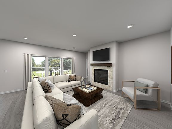 Large windows allow light to flood into the open-concept living space.