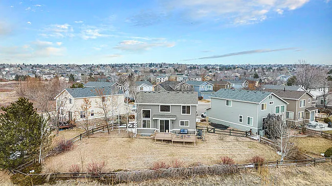 ariel photo of backyard triple lot with views of open space and walking trails