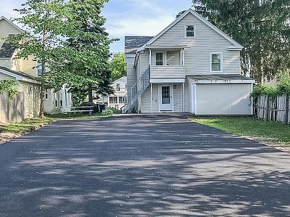 Rear view of 43 Ash Street - Parking lot showcased