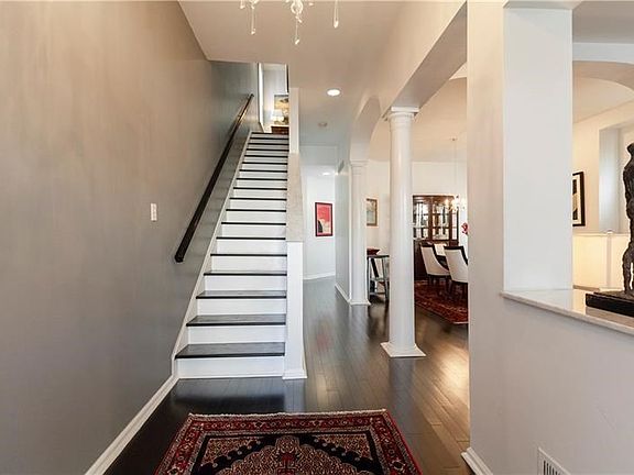 Stunning entrance with open floor plan and breathtaking archways.