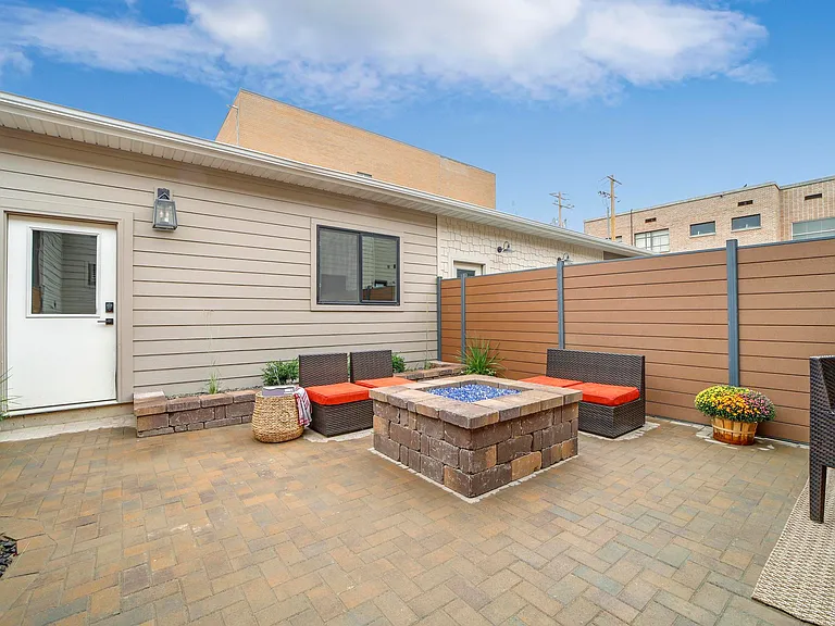 Back Patio With Custom Paver Patio. Gas Firepit With Low Maintenance Needs.