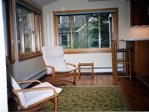 family room with 3 large picture windows and 2 skylights facing south