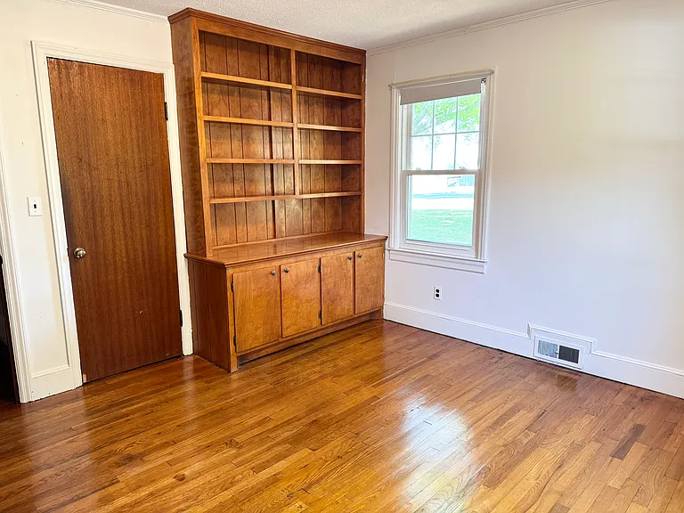 Built in shelves and cabinets in bedroom