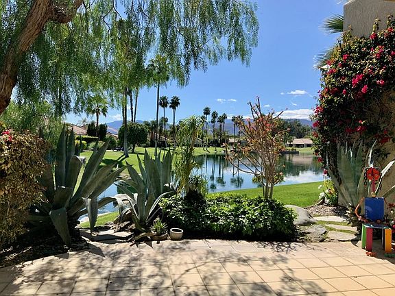 View of the lake from the patio. Relax on our comfy patio furniture.