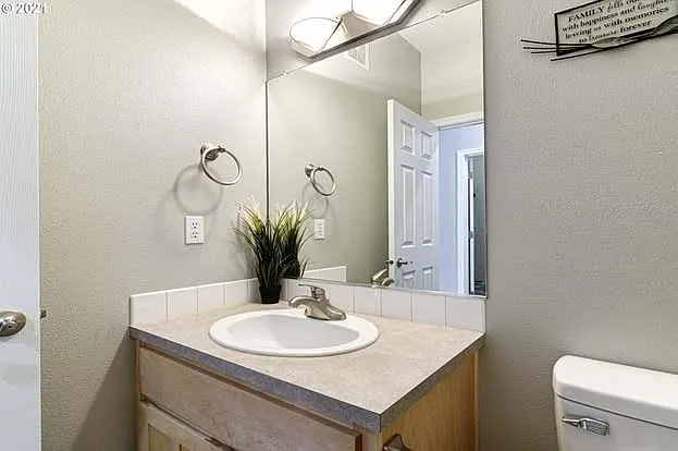 Half bath off family room.