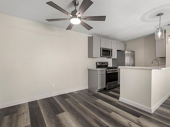 Dining room with ceiling fan.