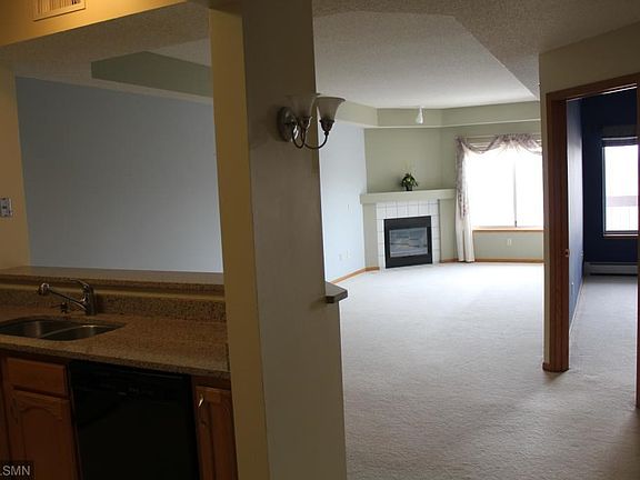The kitchen overlooks the dining and large living room.  The tray ceiling adds height and volume to the living area.