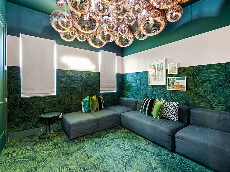 Contemporary interior featuring a striking ceiling light fixture composed of multiple reflective spheres