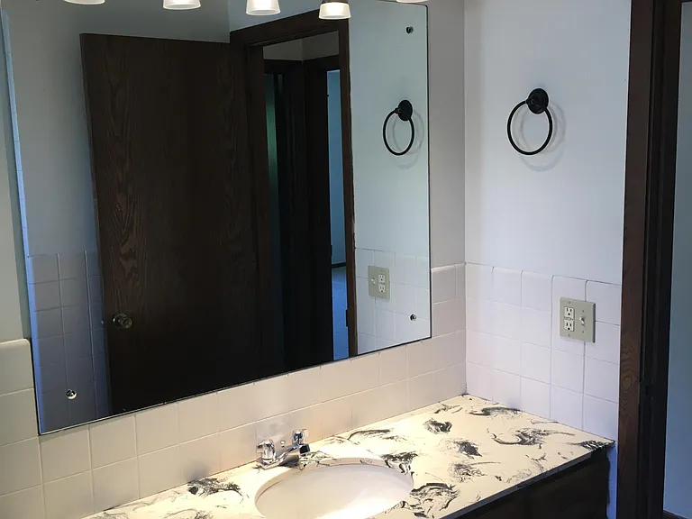 Ceramic Tile Bath with tub / shower.