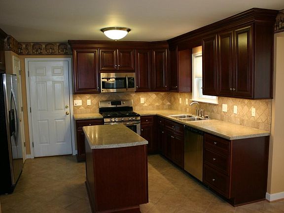 Kitchen View. Includes Gas range, frig, dishwasher, microwave, disposal. Undercounter lighting, pantry closet, etc.