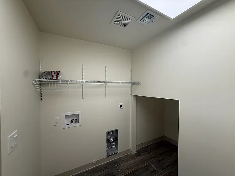 Shelving installed to keep laundry items organized. Wired shelf allows hangers to be hooked into it. Don't have a washer/dryer, landlord will provide.