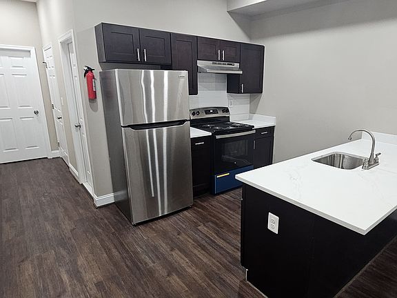 Large kitchen island with lots of cabinets.