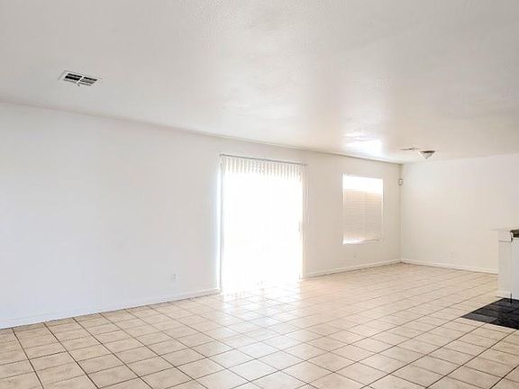 Living room view; sliding door to backyard.