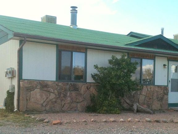 The outside in the summer. Dry landscape, low water usage.