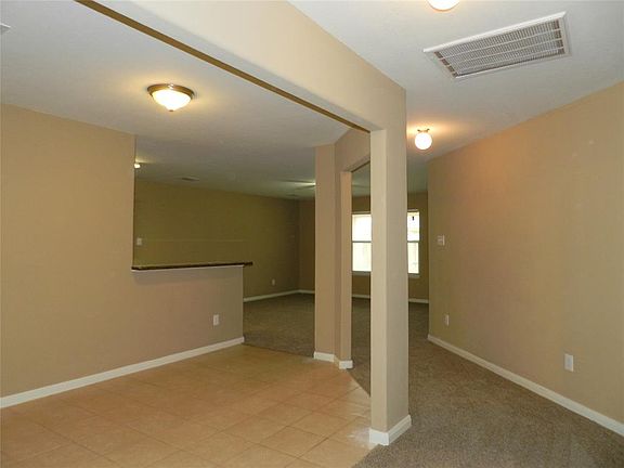 Light and bright open plan. View of the formal dining room.