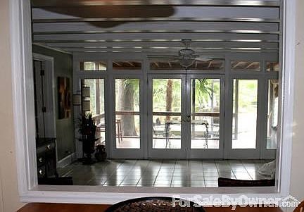 Den With View Of Porch and Backyard