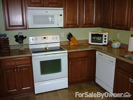 Kitchen
						:
						Glass-top electric range, dishwasher, microwave, and refrigerator all included.