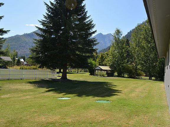 Property extends well past white fence.